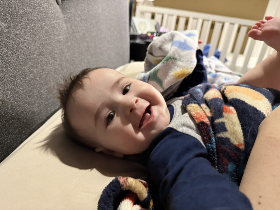 Jack on his back smiling