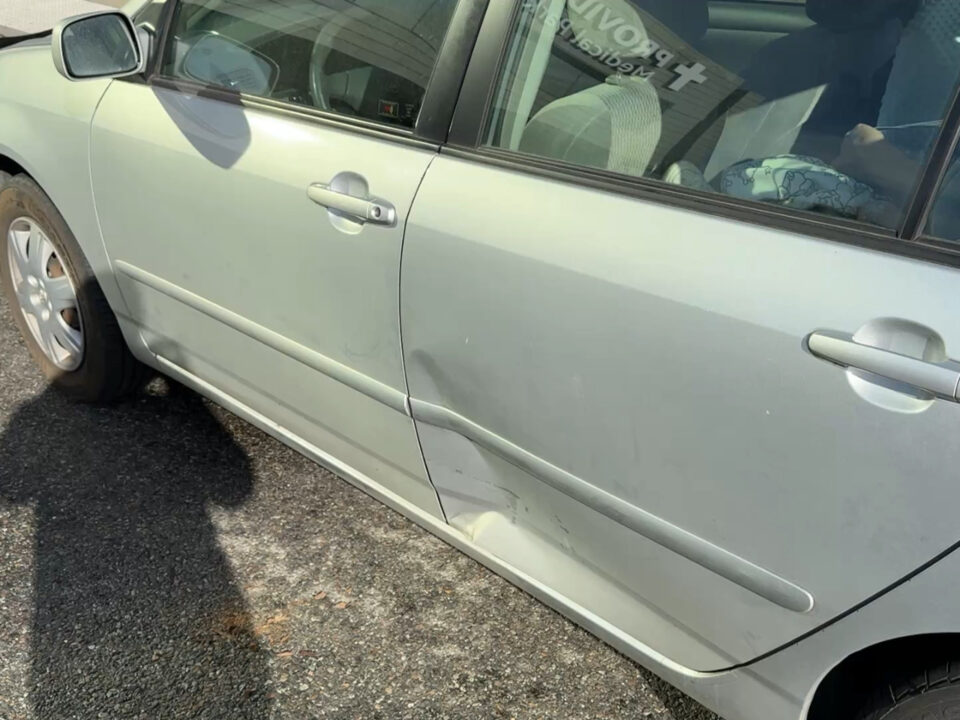 Collision damage to rear driver's side door