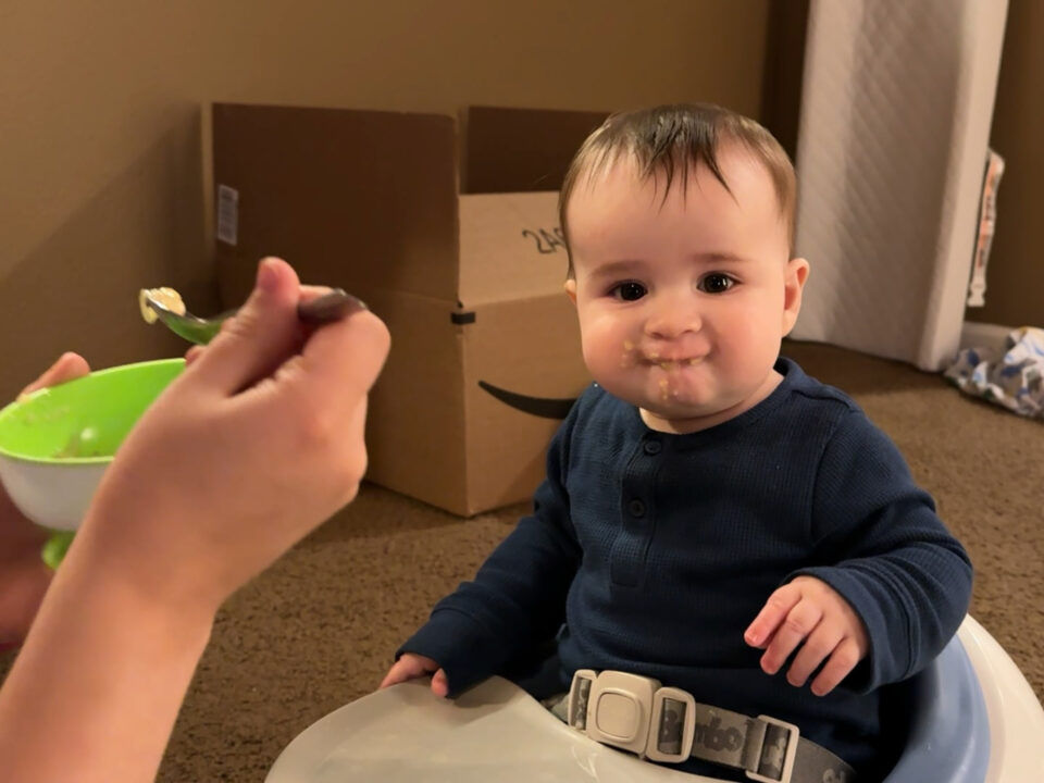 Jack happily munching baby food