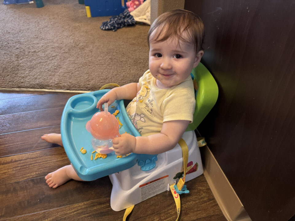 Jack in his little chair enjoying a snack