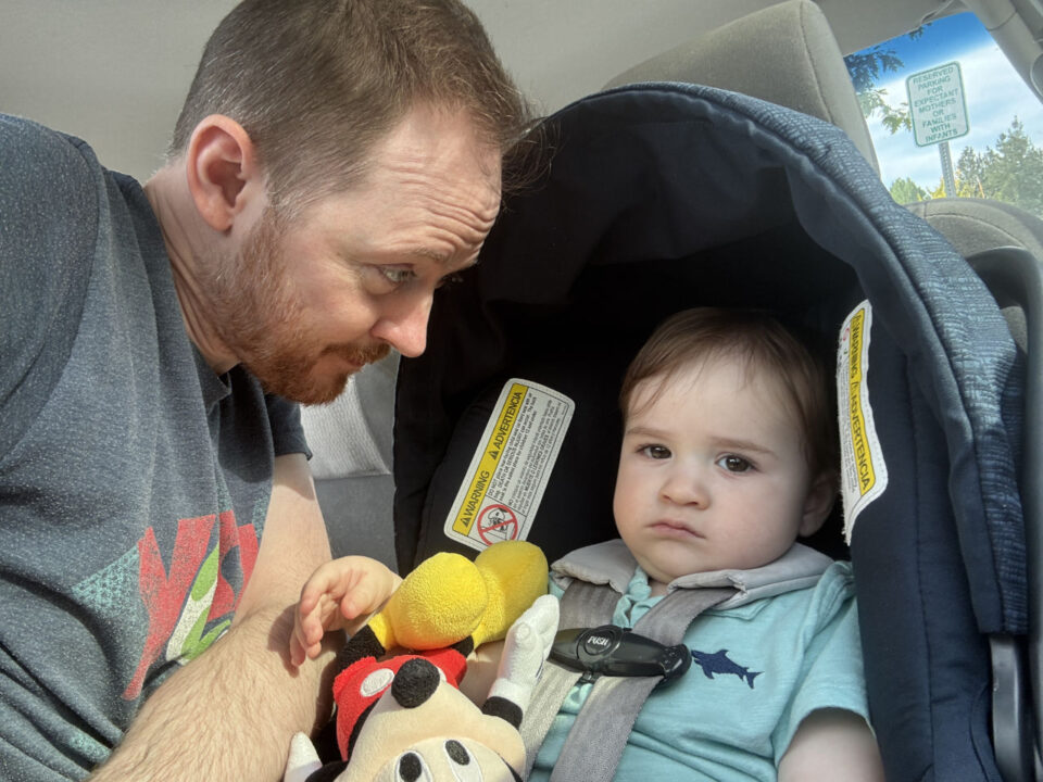 Daddy visiting Jack in the back seat of the car