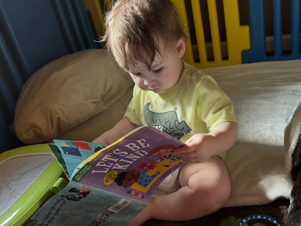Jack looking at a book like he's reading